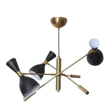 Queenstown 6 light Mid-Century chandelier shown illuminated with black cone shades, exposed globe bulb detail, and brass-tone arms.
