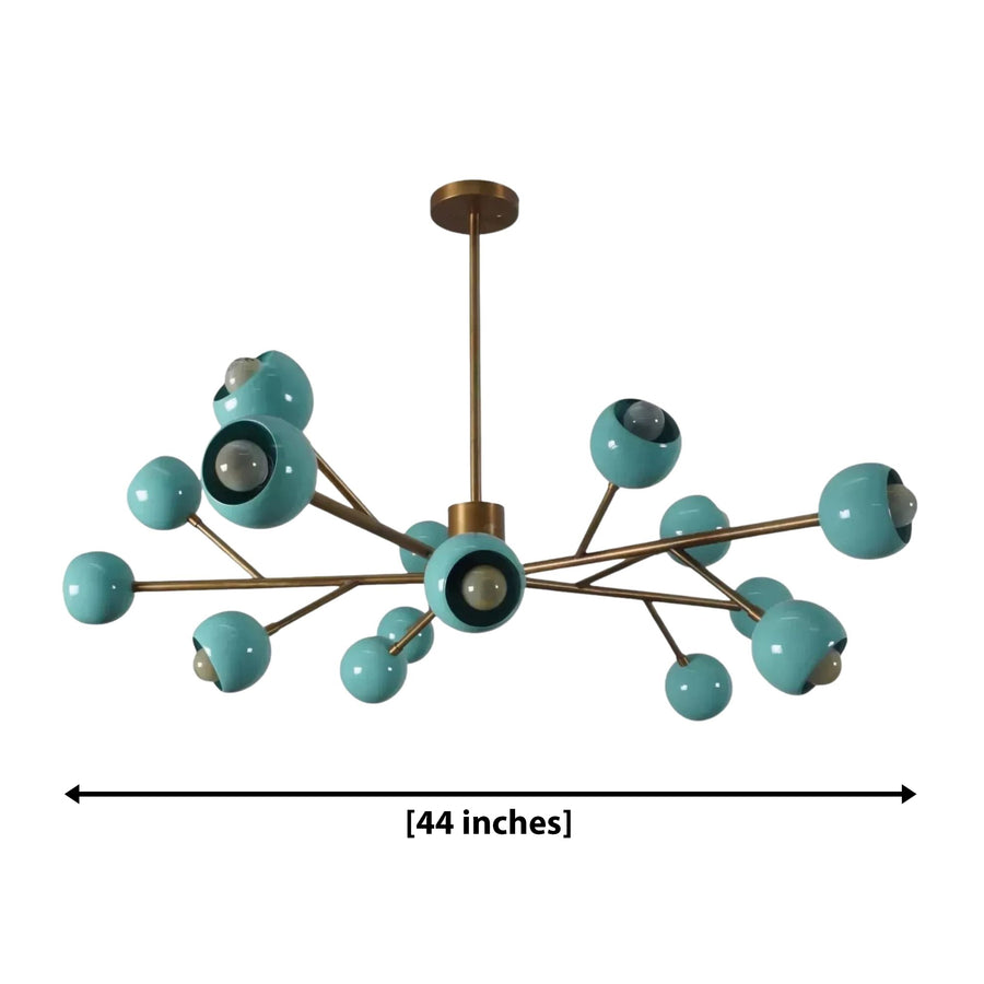 Ravenna 15-light Mid-Century Modern chandelier suspended above a walnut dining table with cream upholstered chairs, creating warm ambient lighting in an elegant contemporary dining room.