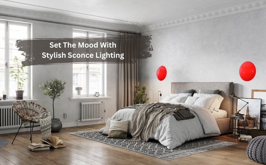 Set of two red disc wall sconces glowing with warm ambient halo, modern eclipse-inspired brass wall lighting