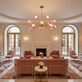 Rhodes 12 light pink globe Sputnik chandelier with brass suspension rod, round canopy and sculptural multi-arm design.