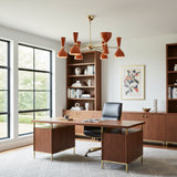 Saint Tropez 12 light Mid-Century Modern chandelier with glossy orange metal shades arranged around a brass-tone Sputnik frame.