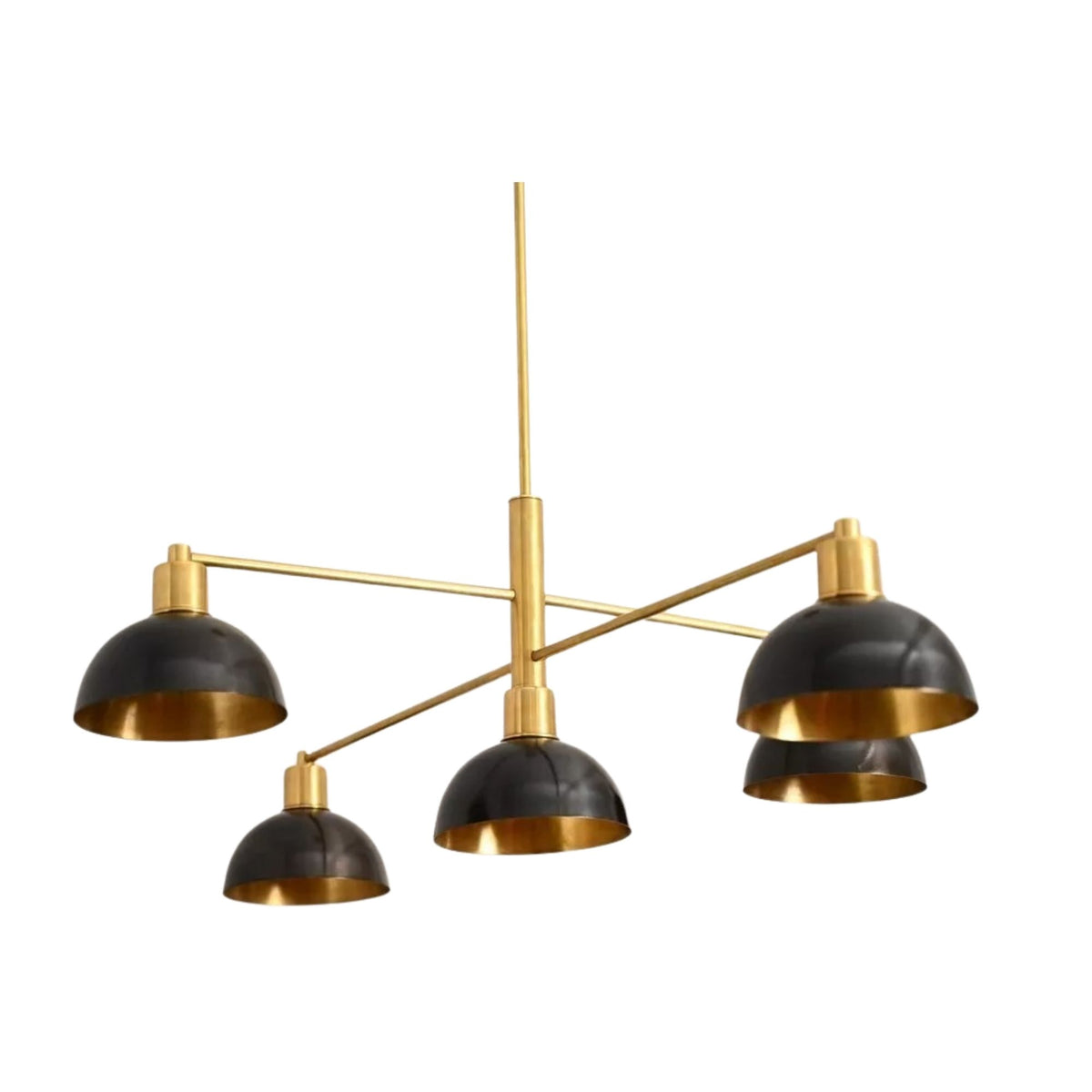 San Sebastian 5 light sculptural chandelier shown from an alternate angle highlighting the asymmetric brass-tone arms and black dome shades.