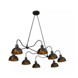 Santander 8 light black linear chandelier shown from an angled view with curved arms and brass-tone shade interiors.
