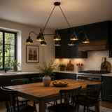Santander 8 light black dome chandelier illuminating a modern kitchen dining area with warm ambient lighting.