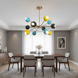 Santorini 12 light Sputnik chandelier shown from an angled view with turquoise, yellow, and black globe shades.