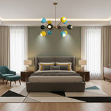 Santorini 12 light colorful globe chandelier shown in a full product view with radiating brass arms and sculptural shades.