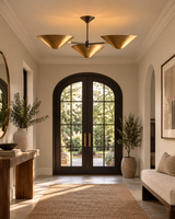 Santorini 3 light Mid-Century Modern cone chandelier installed in an elegant entryway with warm brass-tone shades.