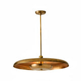 Sculpted brass disc chandelier with indirect ambient glow and slim downrod, handcrafted in brushed brass by Brass Leaf Studio.