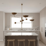 Seoul 3 light Mid-Century chandelier shown from an alternate angle with asymmetrical bowl shades and spherical counterbalance accents.