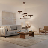 Seoul 3 light counterbalance chandelier shown from an angled view with three wide bowl shades and decorative spherical counterweights.