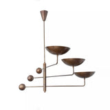 Seoul 3 light Mid-Century Modern counterbalance chandelier shown from the front with sculptural bowl shades, brass-tone arms, and spherical accents.