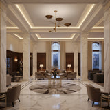 Seoul 3 light sculptural chandelier shown from a side angle highlighting its multi-level arms, bowl shades, and brass-tone orb details.