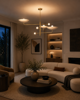 Seville 3 light brass sculptural bowl chandelier displayed in a modern living room with warm ambient lighting.