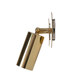 Side profile of Milan antique brass adjustable cylinder wall sconce highlighting the swivel spotlight head and solid brass mounting bracket.
