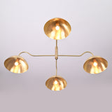 Bottom view of Siena Curved Arm chandelier with four glowing dome shades and warm reflected light.