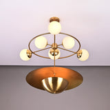 Siena Globe Disc Chandelier shown with glowing globe lights and sculptural layered disc shade on neutral background.