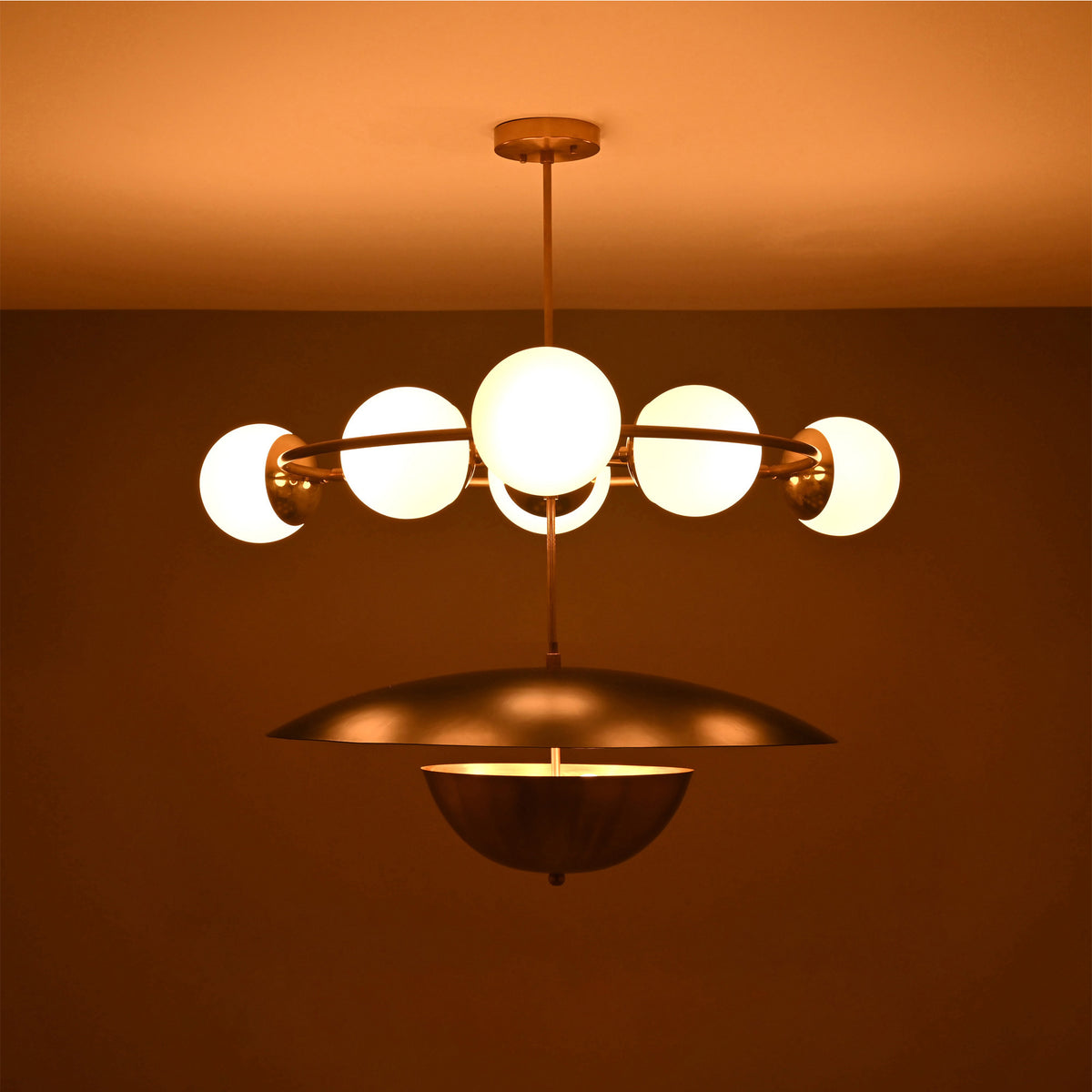 Siena Globe Disc Chandelier side view showing glowing globe lights, circular arm frame, and warm ceiling illumination.