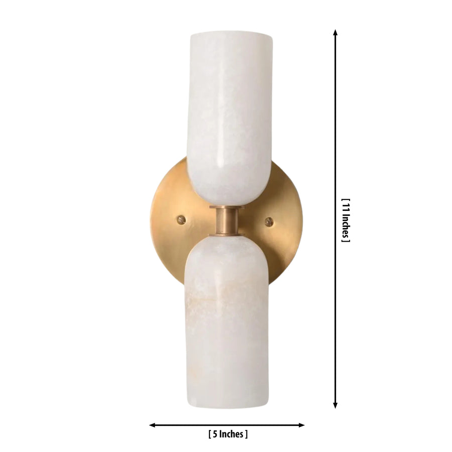 Sloane Double Cylinder Alabaster Wall Sconce installed in a modern hallway, providing warm ambient lighting with handcrafted alabaster shades and a solid brass finish.