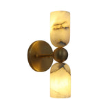 Front angled view of the Sloane Dual Alabaster Cylinder Wall Sconce featuring handcrafted natural alabaster shades, solid brass backplate, and sculptural sphere center.