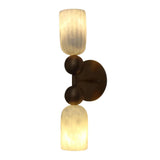 Rear angled view of the Sloane Dual Alabaster Globe Wall Sconce highlighting the round brass wall canopy, brass mounting arm, and illuminated alabaster shades.