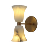 Front illuminated view of the Sloane Hourglass Alabaster Wall Sconce featuring handcrafted double flared alabaster shades with a solid brass backplate and warm ambient lighting.