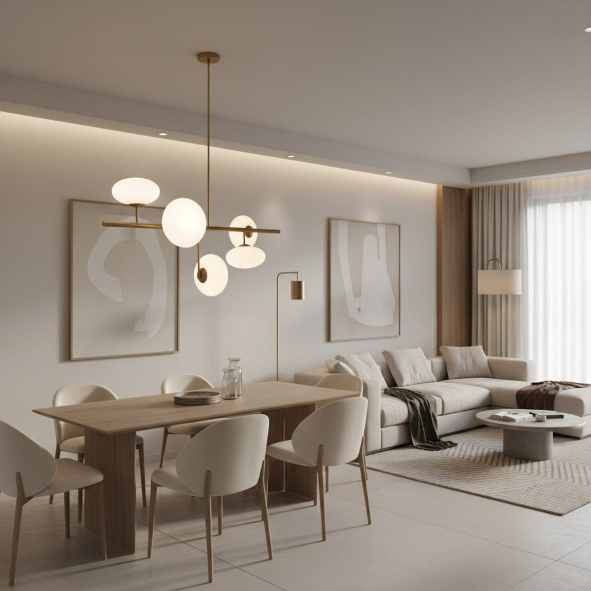 Angled view of Sloane 5 light chandelier with opal glass shades arranged around a linear brass frame.