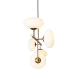 Side view of Sloane linear chandelier featuring five sculptural opal glass shades and brass frame.