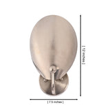 Front view of the Sloane Modern Oval Shield Wall Sconce displaying the handcrafted oversized oval metal shield with overall dimensions of 12 inches high and 7.5 inches wide.