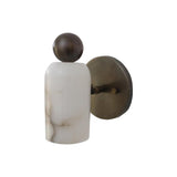 Angled view of the Sloane Rounded Alabaster Wall Sconce showcasing the handcrafted alabaster cylinder, globe finial, and premium metal wall mount.