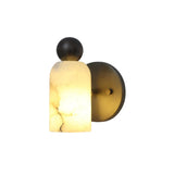 Illuminated front detail of the Sloane Rounded Alabaster Wall Sconce highlighting the warm glow through genuine natural alabaster.
