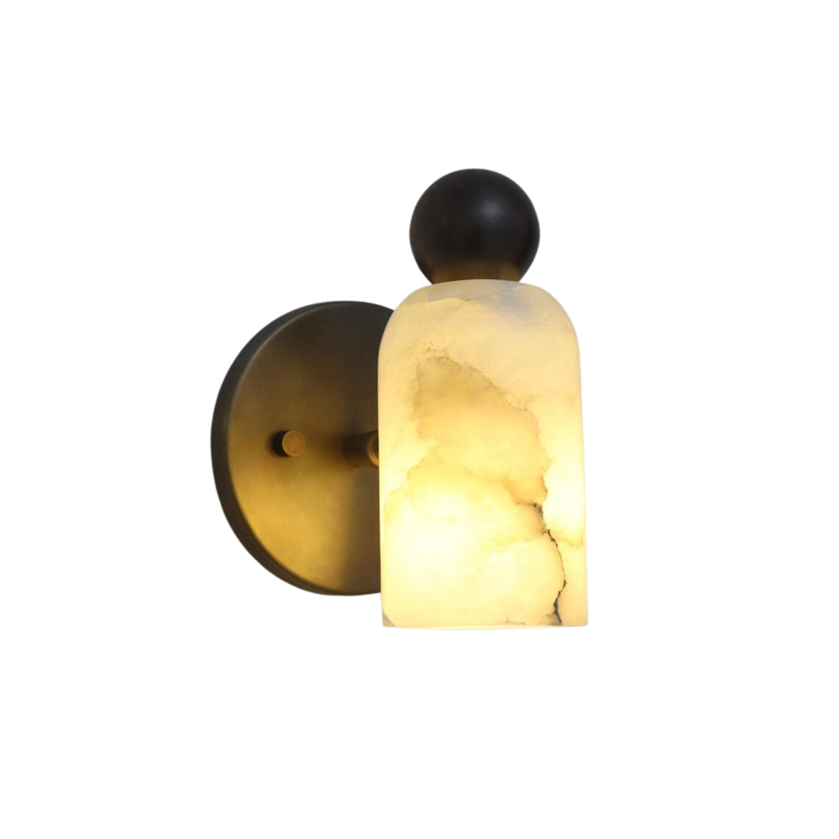 Front illuminated view of the Sloane Rounded Alabaster Wall Sconce featuring a handcrafted natural alabaster cylinder shade with decorative globe finial and antique brass backplate.