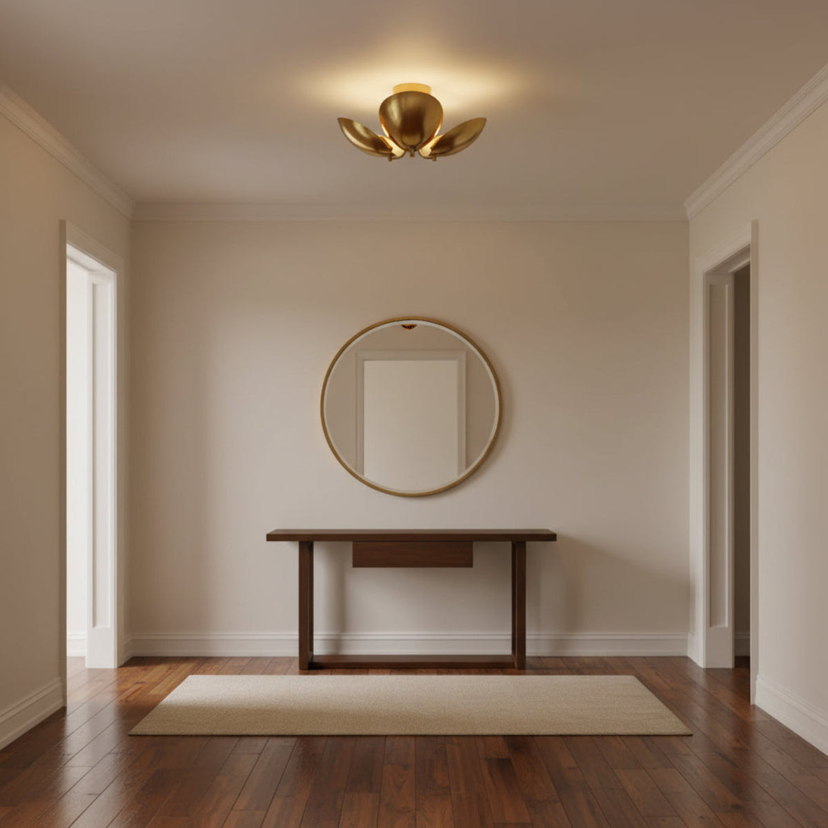 Sloane sculptural petal flush mount in polished brass finish with three curved metal shades, angled view