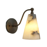 Front view of the Sloane tapered alabaster wall sconce featuring a handcrafted natural alabaster cone shade with a curved solid brass arm and warm illuminated glow.