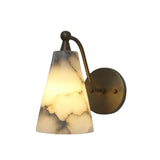 Side profile of the Sloane tapered alabaster wall sconce featuring a sculptural curved brass arm supporting a handcrafted natural alabaster cone shade.