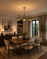 Soho 3 light brass dome chandelier displayed above a large wooden dining table in a warm Mid-Century Modern dining room.