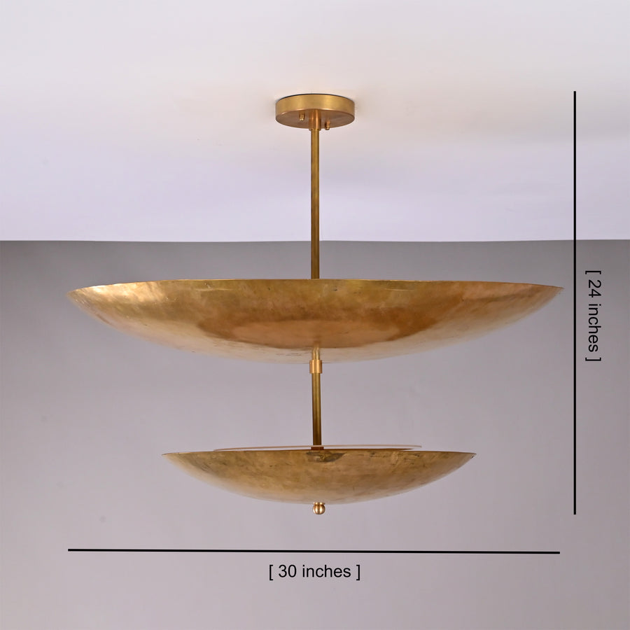 Solara Double Saucer Pendant Light installed in a warm living room with soft ambient ceiling glow.