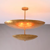 Front view of Solara Double Saucer Pendant Light with two layered saucer shades and warm glow.