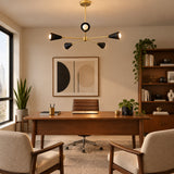 Straight front view of Sorrento black and brass 5-light chandelier with geometric cone holders and exposed globe bulbs.