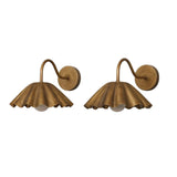 Pair of Sorrento modern brass pleated dome wall sconces featuring handcrafted scalloped shades, curved wall arms, and frosted globe diffusers.