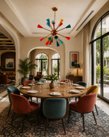 Stockholm 16 light multicolor Sputnik chandelier centered above a large wood dining table in an elegant contemporary dining room.