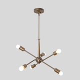 Angled view of Strasbourg 6 light Sputnik chandelier featuring antique brass-tone arms and exposed globe bulbs.
