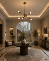 Strasbourg 6 light antique brass Sputnik chandelier displayed in an elegant entryway with warm ambient lighting.