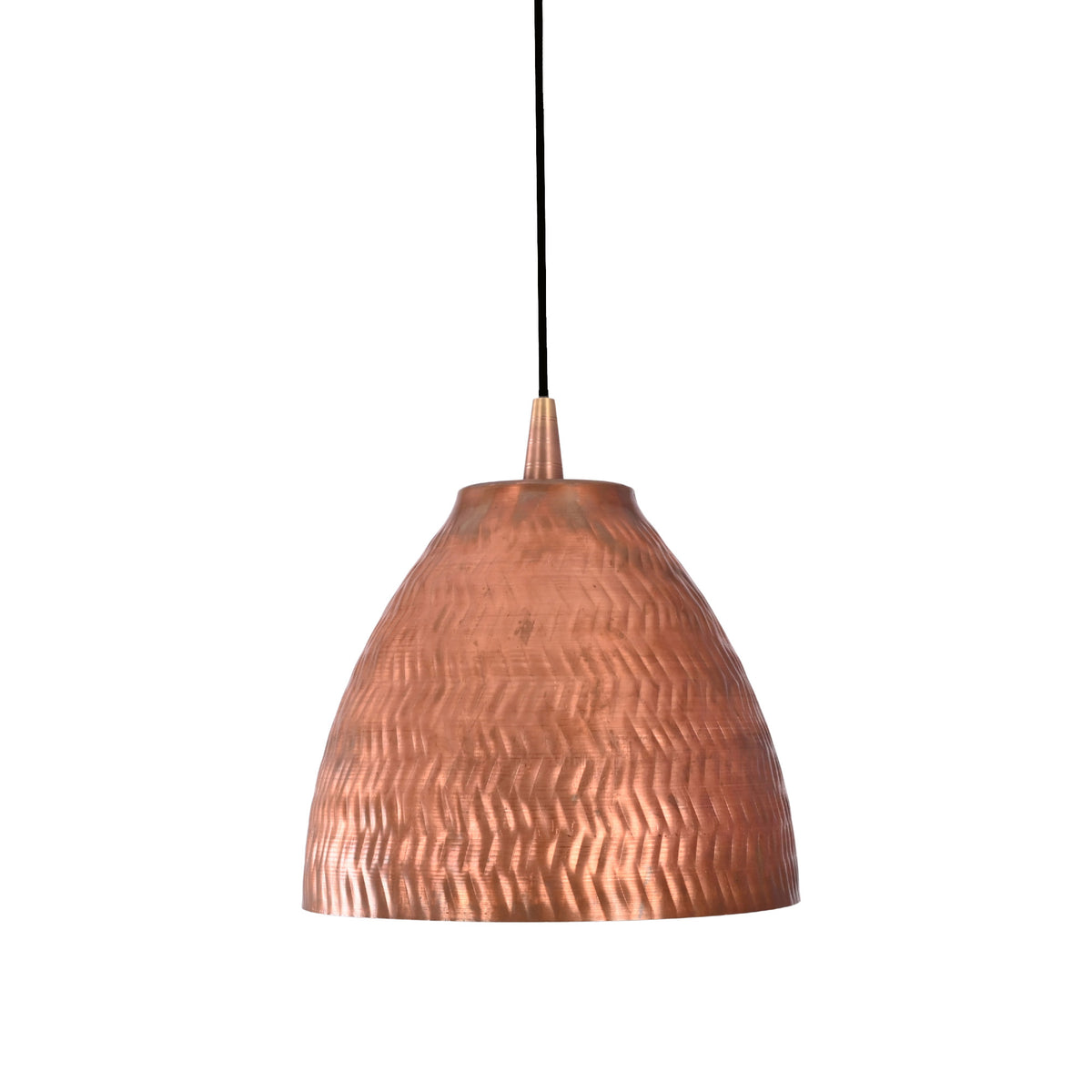 Warm illuminated view of the Sutton handcrafted hammered copper bell pendant with focused downward lighting and decorative textured finish.