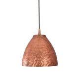 Warm illuminated view of the Sutton handcrafted hammered copper bell pendant with focused downward lighting and decorative textured finish.