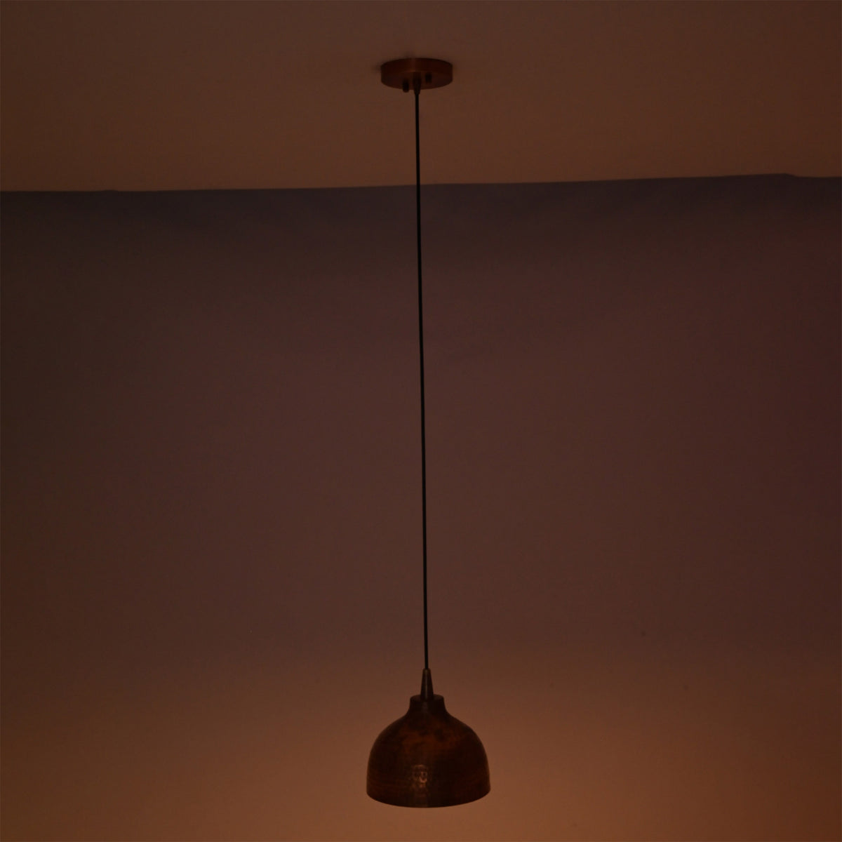 Unlit Sutton hammered copper mini dome pendant light showcasing its artisan hammered copper finish and minimalist suspended design.