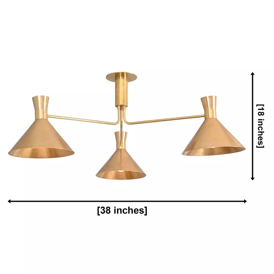 Sutton 3 light brass linear cone chandelier installed above a dining table in a warm modern kitchen interior