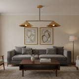 Sutton 2 light linear chandelier with wide brass cone shades and contrasting black frame, front view