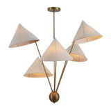 Angled view of the Sutton Modern five-light chandelier highlighting sculptural cone fabric shades, warm ambient lighting, and a brushed brass finish.