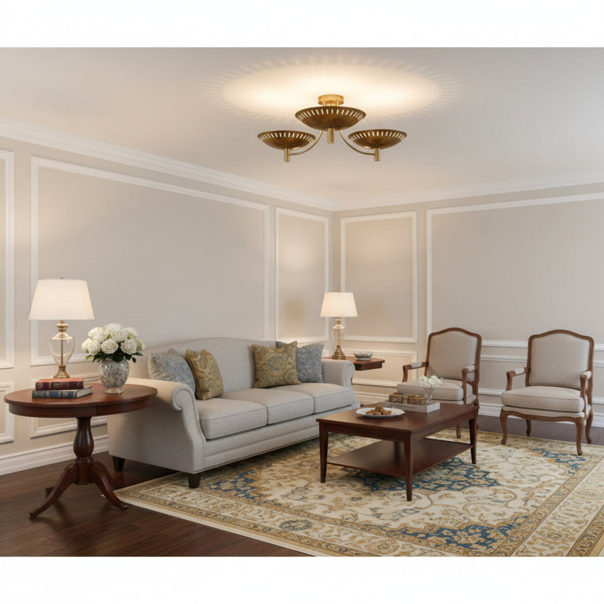 Bottom view of Sutton 3-light chandelier showing perforated brass bowl shades and curved frame