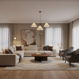 Sydney 3 light brass-tone chandelier shown from the front with oversized cream cone shades and a sculptural multi-level design.